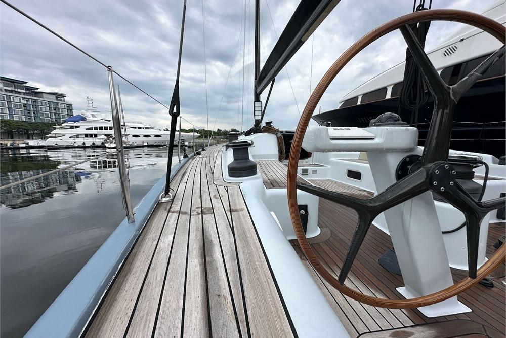 Sleek 2005 Simonis Voogd 56 yacht with wooden deck and steering wheel