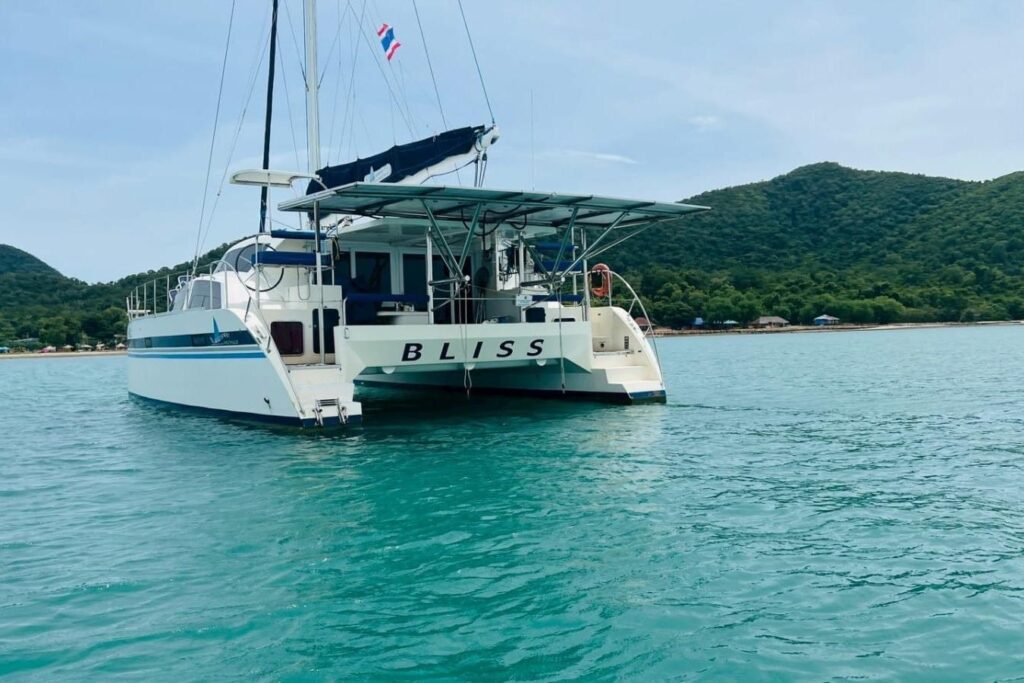 Island Spirit 380 catamaran named "Bliss" anchored in serene turquoise waters