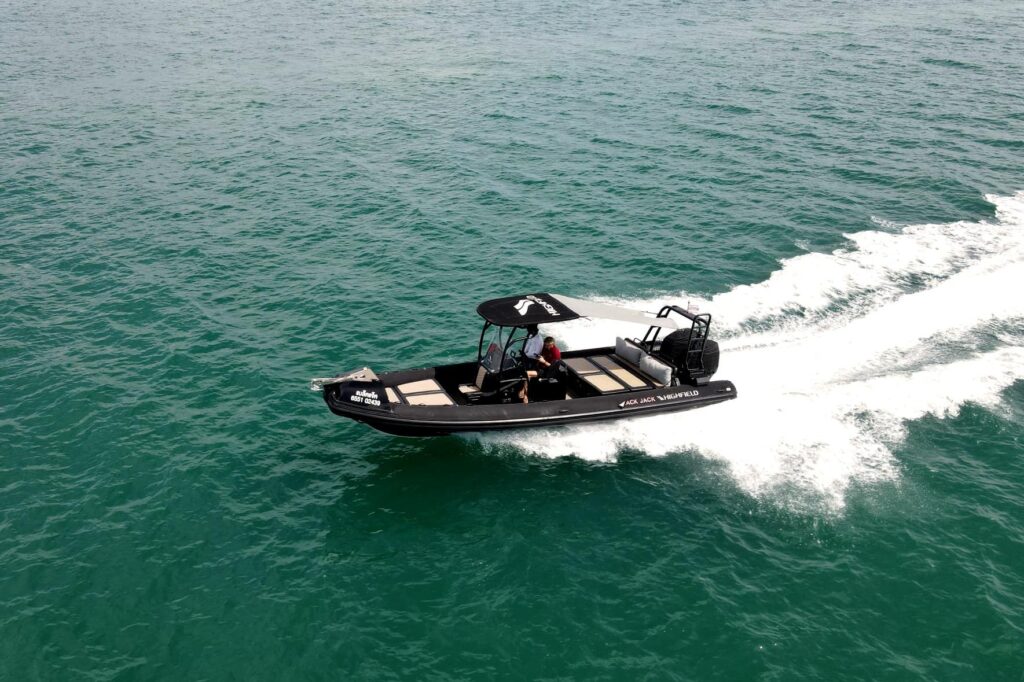 2019 Highfield Patrol 860 boat cruising on open water.